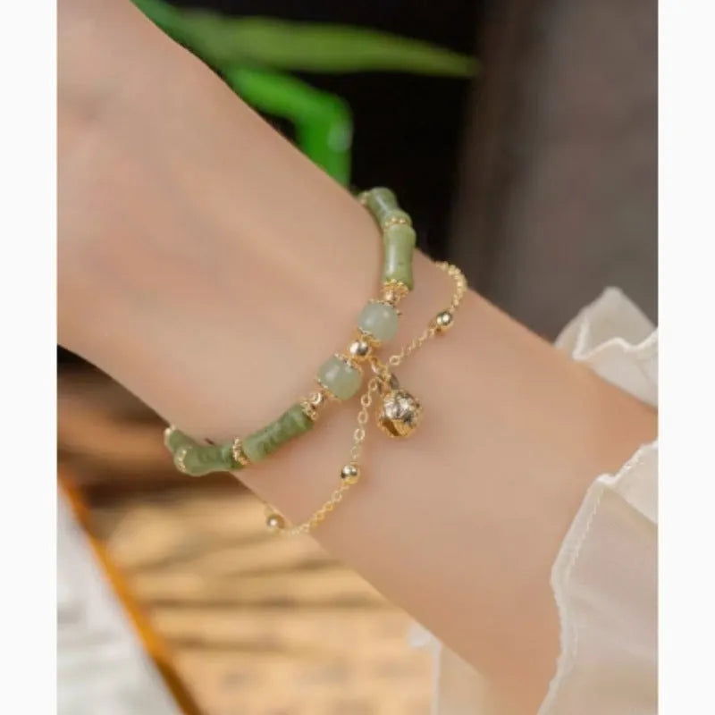 Women's natural Hetian jade bamboo bracelet on white background, adjustable 15+3 cm size