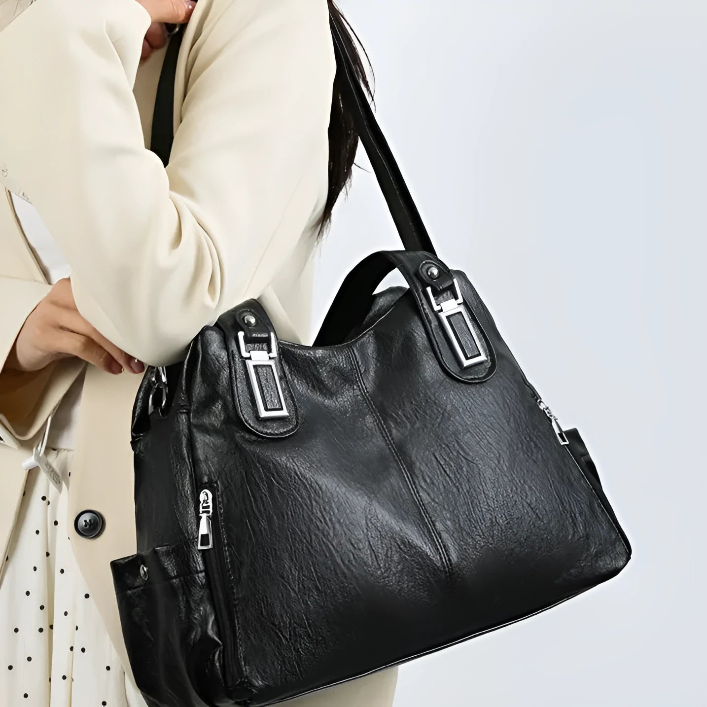 Soft PU women's tote bag in square vertical model with single shoulder strap showing internal organisational pockets