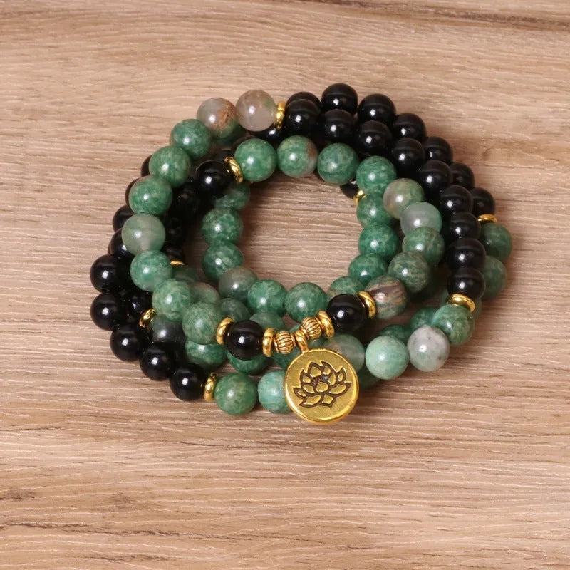 Green and black elastic beaded bracelet with alloy construction