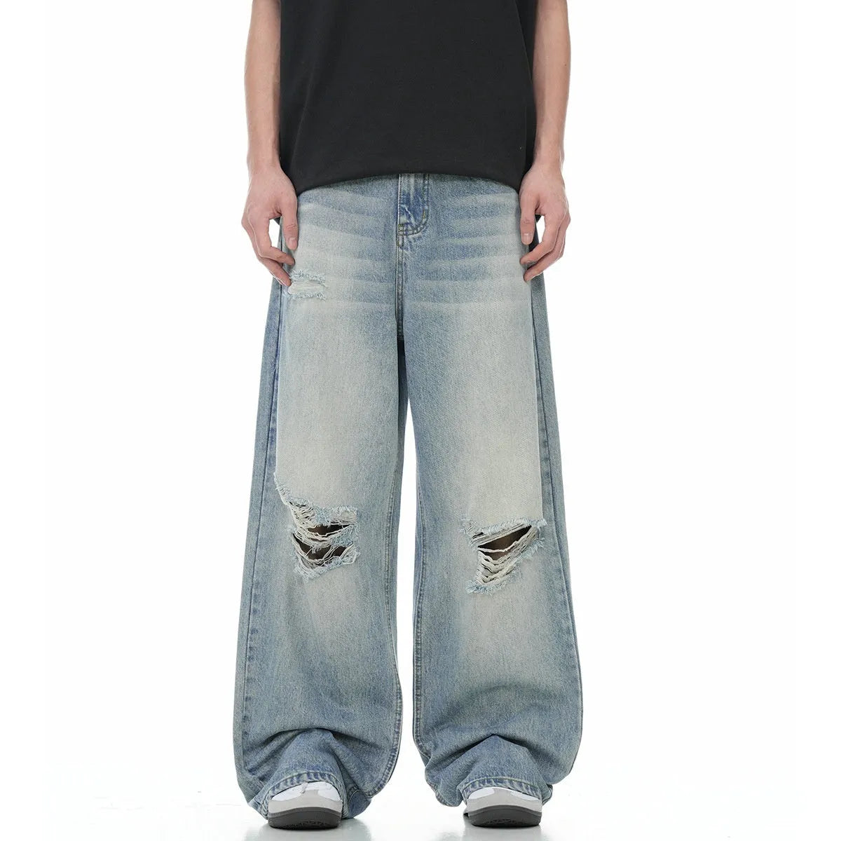 Blue men's straight-leg ripped jeans on a neutral background, showing zipper fly and cotton blend fabric texture.