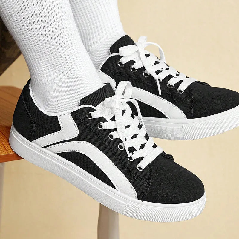 Women's canvas low top skateboard shoes with colour block sewing thread detail, beige brown colour, flat heel, front lace-up