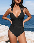 Women's solid colour one-piece swimsuit with bikini triangle top and cross shoulder straps.