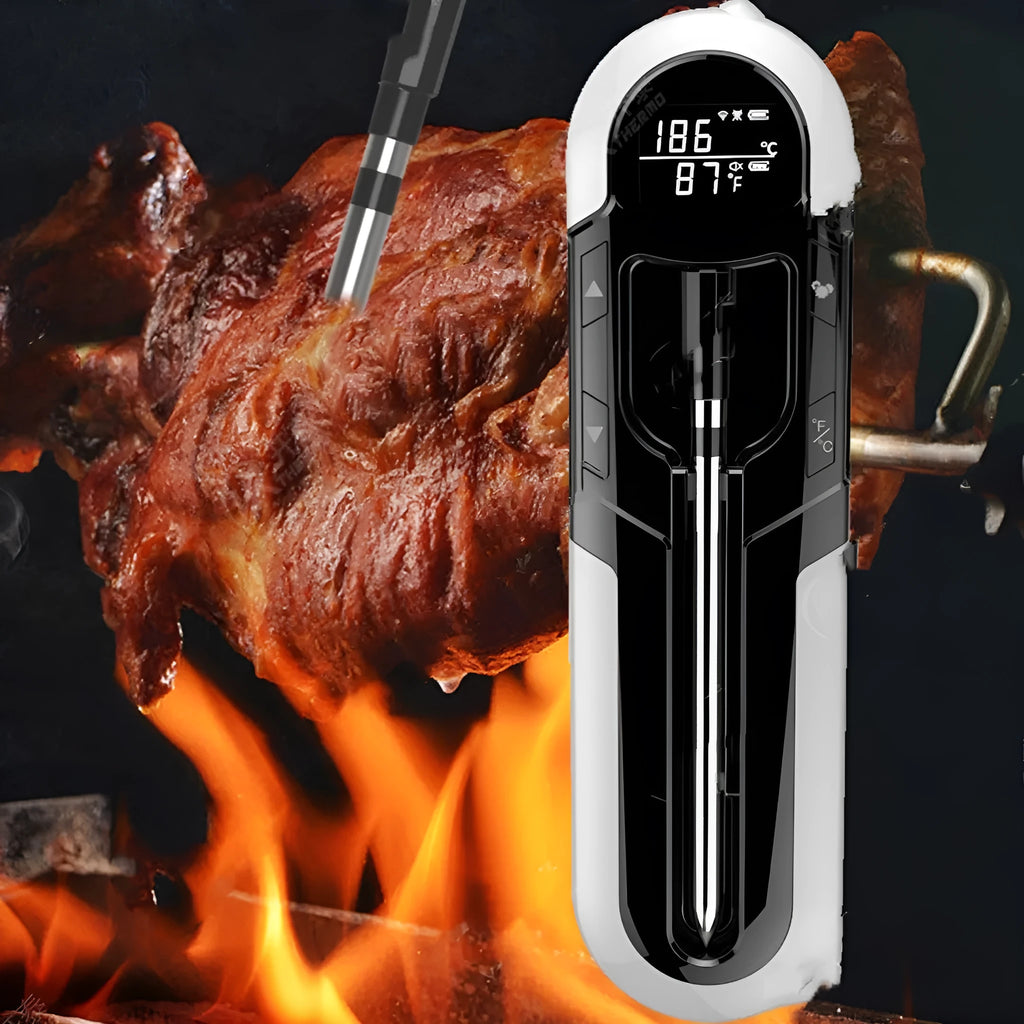 Blue portable Bluetooth barbecue thermometer with magnet design and LCD screen on a metal grill surface