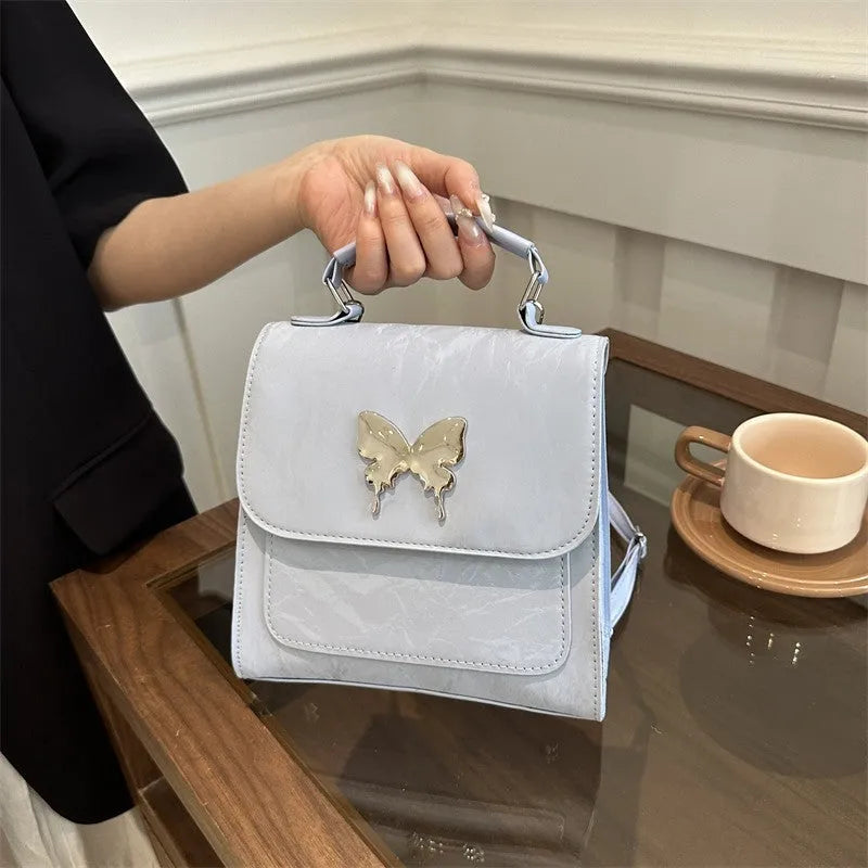 Preppy style women's backpack handbag in PU leather with bow detailing and six colour options