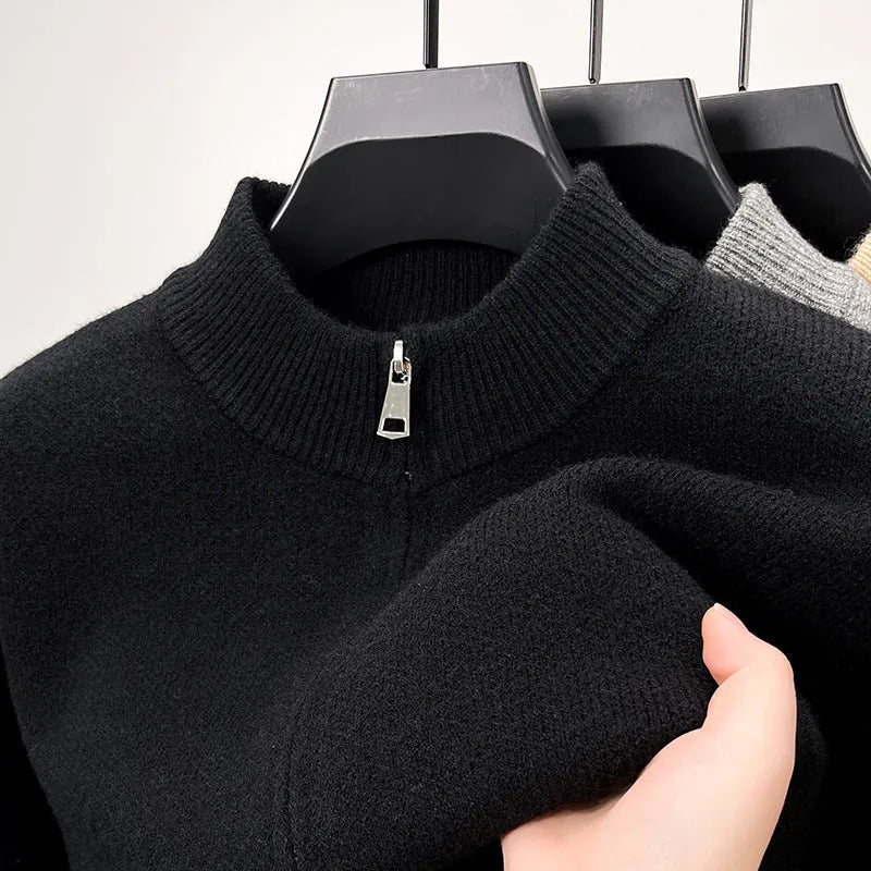 Man wearing a grey stand collar knitted cardigan with a front zipper.