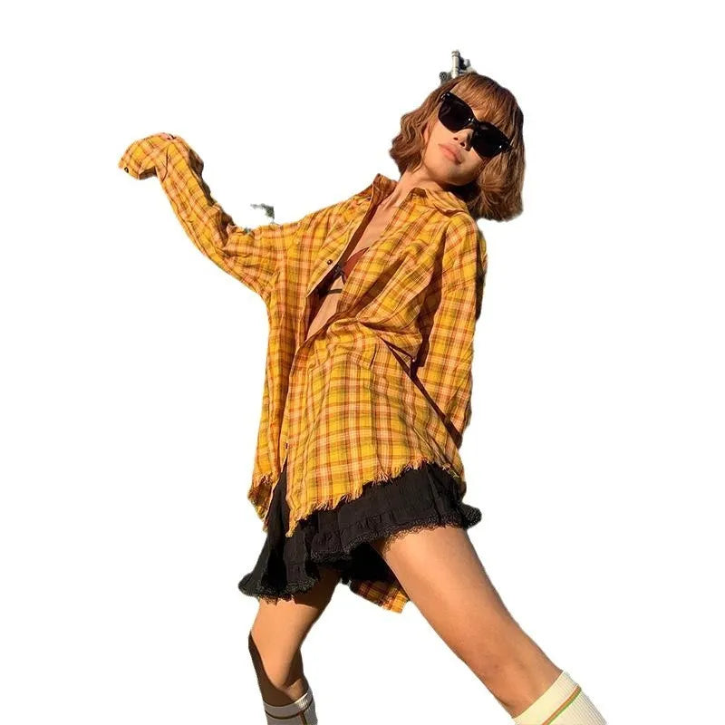 Dopamine yellow and black plaid shirt on a hanger, showing loose fit and cardigan style.
