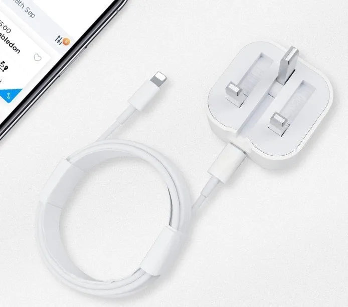 White 20W USB-C UK wall charger with a fixed three-pin plug and a USB-C cable.