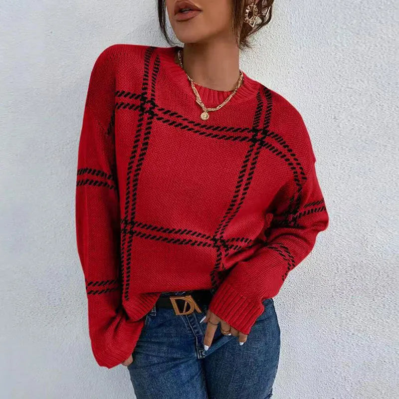 Women's loose-fit acrylic pullover sweater with a red, green, and beige plaid colour-block pattern.