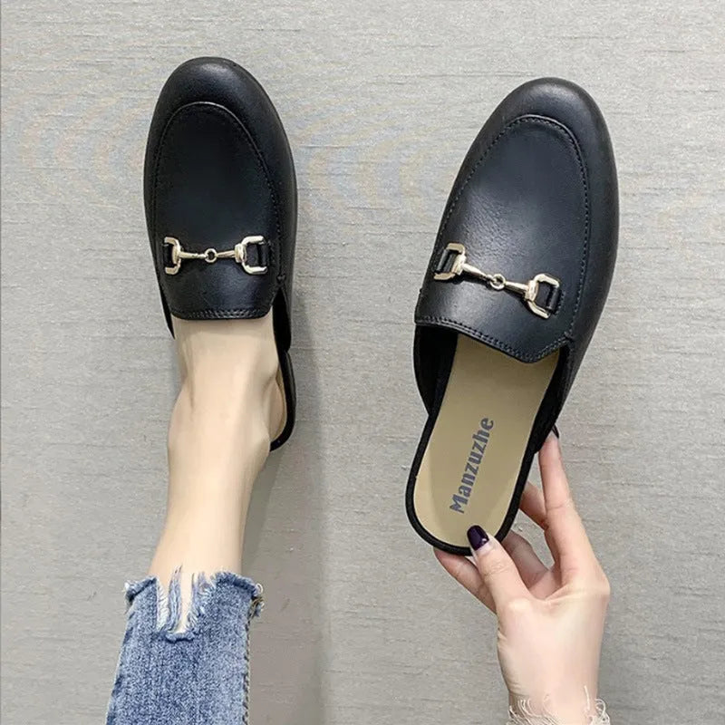 Women's PVC closed toe half slipper in black with a D buckle closure on a white background.