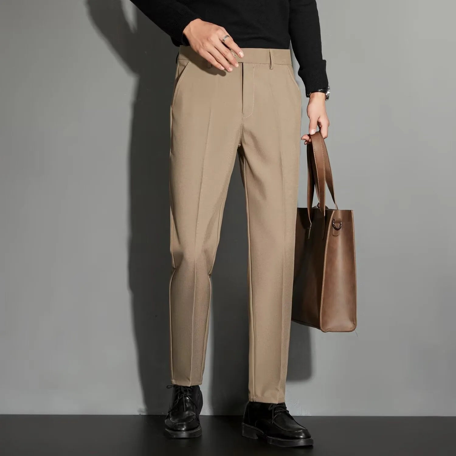 Men's straight cut ankle-length trousers in draping fabric showing apricot colour option