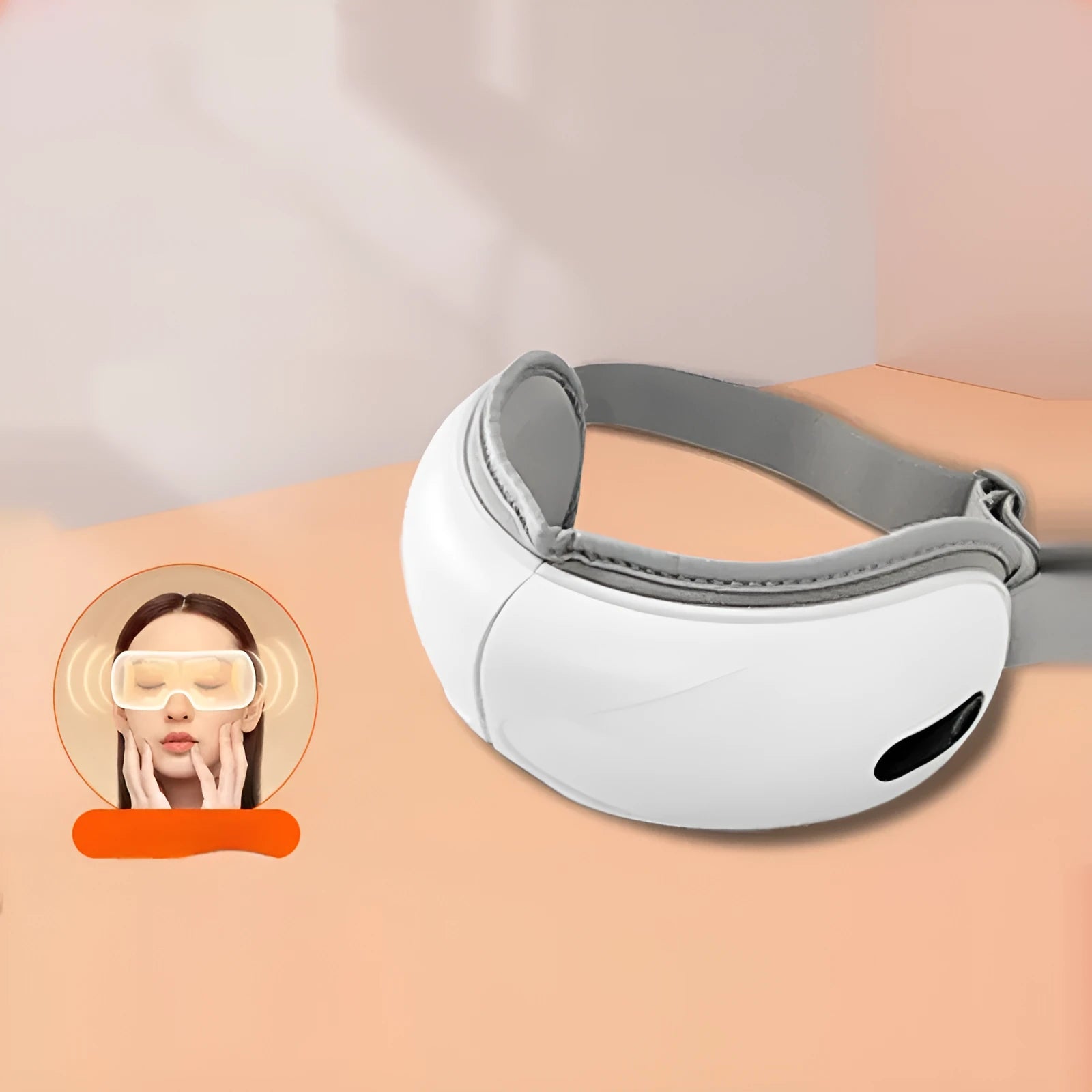 White rechargeable eye massager with airbag compression and hot compress functions on a plain background.