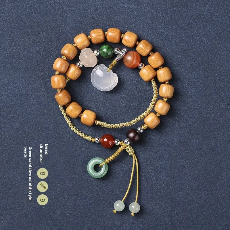 Hand-woven ebony wood bracelet with double ring design and traditional Chinese Ruyi elements