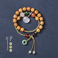 Hand-woven ebony wood bracelet with double ring design and traditional Chinese Ruyi elements