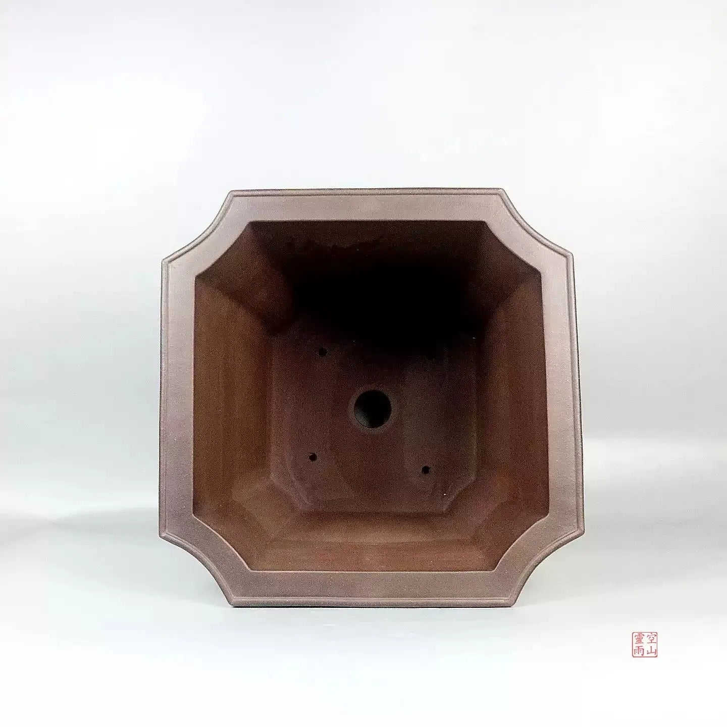 Ceramic antique redware flowerpot purple sand finish 40x40x40cm on a wooden table