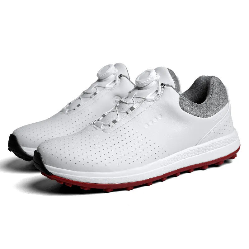 Men's white and black casual low-top golf shoes with breathable hollow-out design and non-slip sole.