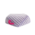 Striped orange plush fabric pet bed with a removable cover, shown in a home setting.
