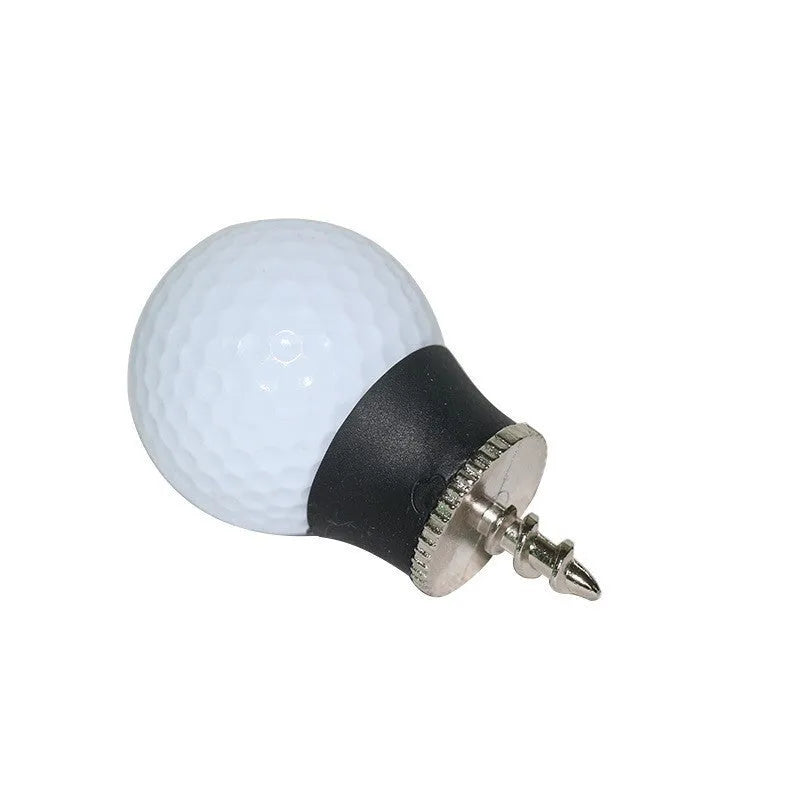 Black TPR golf ball suction cup picker with conventional size on a green surface