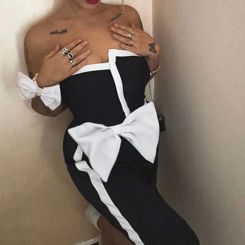 Women's black and white colour-block one-piece swimsuit with bow detail and tube top neckline