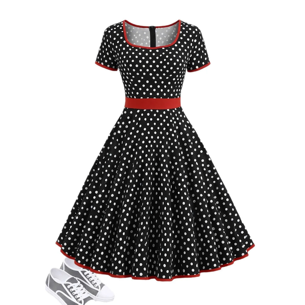 Multicolour polka dot pleated dress with square collar and short sleeves on a hanger.