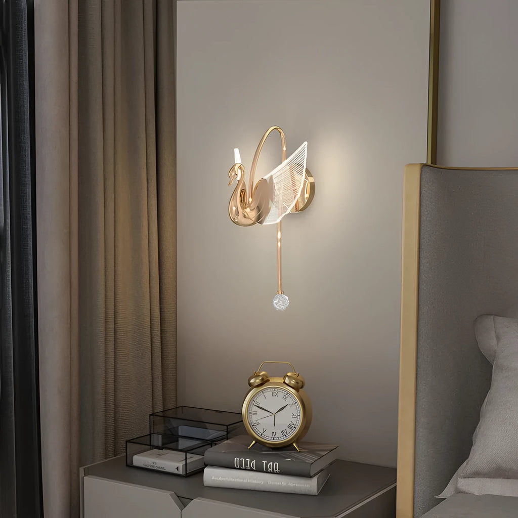 Gold modern swan-shaped bedside wall lamp with acrylic shade and dimmable LED lighting.