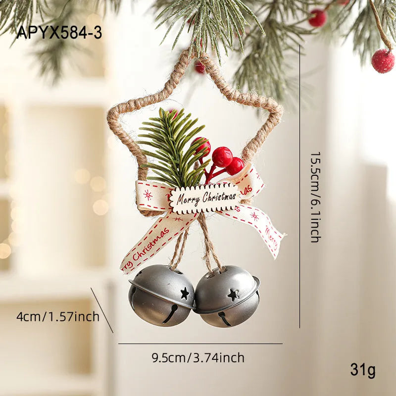 Iron Christmas bell ornament in gold hanging on a Christmas tree branch