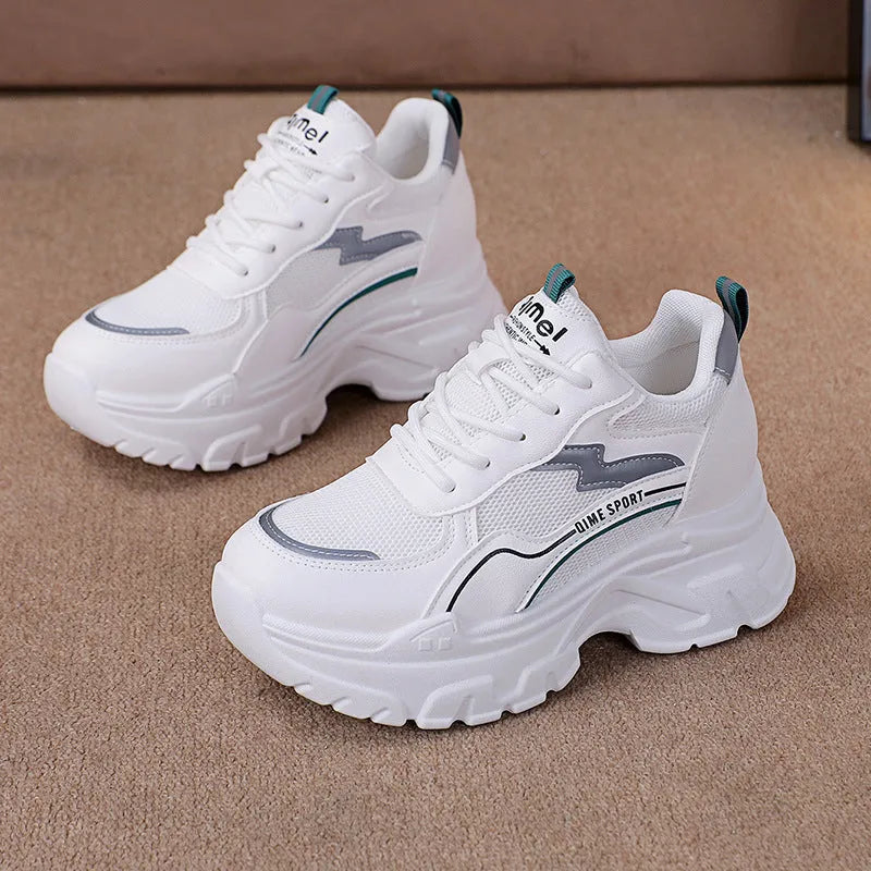 Women's white breathable dad shoes with lace-up front and cross shoulder strap on a rubber sole.