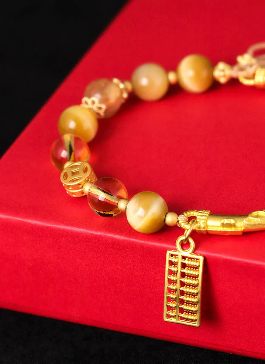 Women's abacus tag bracelet with tigereye and citrine beads and copper diamond-shaped tag