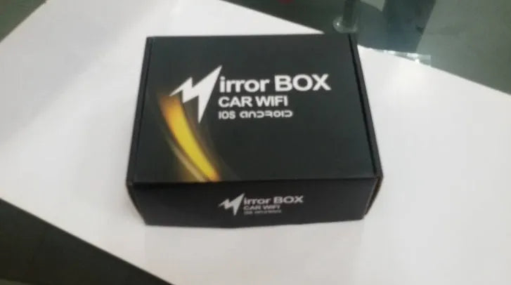 Black car mirror link box Wi-Fi converter with power cable, antenna, and AV cable for smartphone screen mirroring.