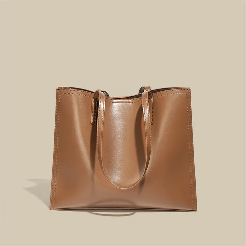 Genuine leather women's one shoulder handbag in a horizontal square shape showing internal compartments.
