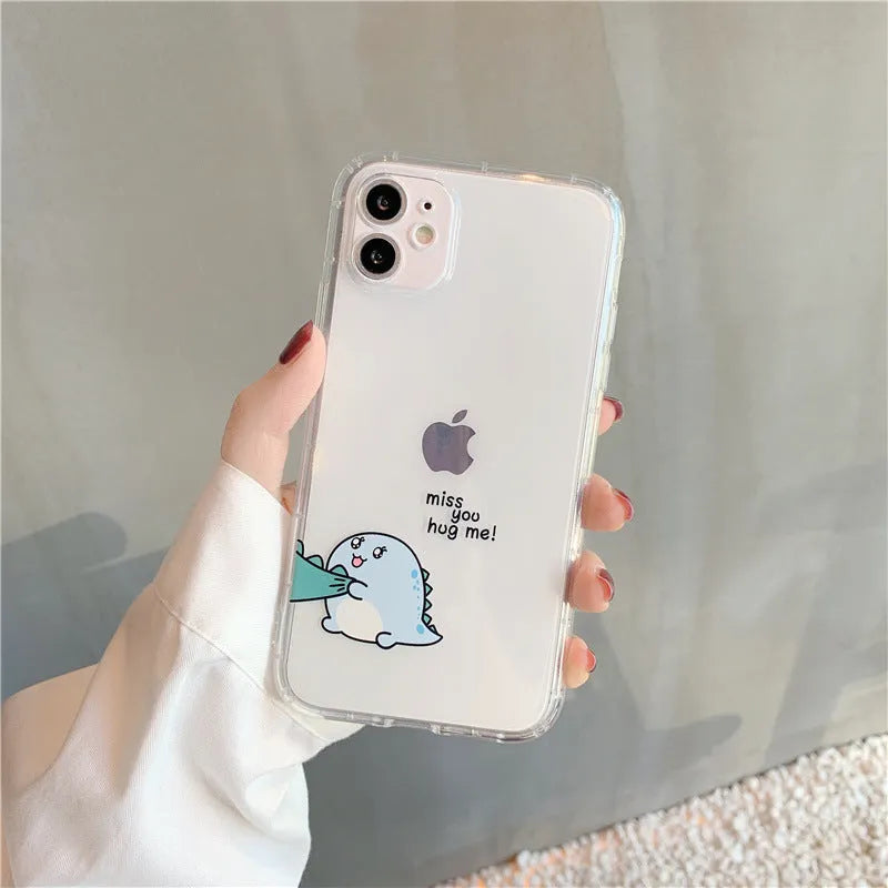 Clear transparent iPhone case with green dinosaur design showing phone protection