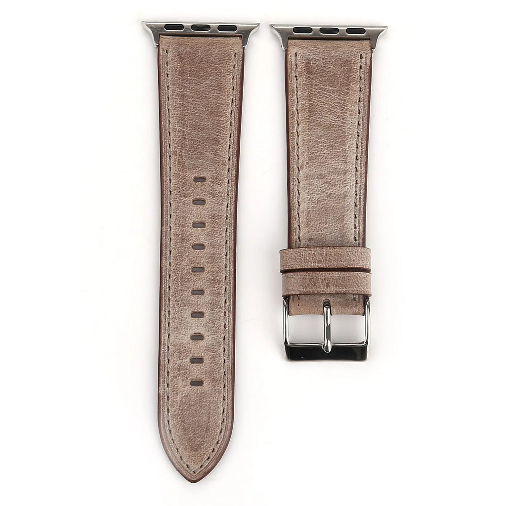 Genuine leather watch strap with a folding buckle in various colours on a grey background.