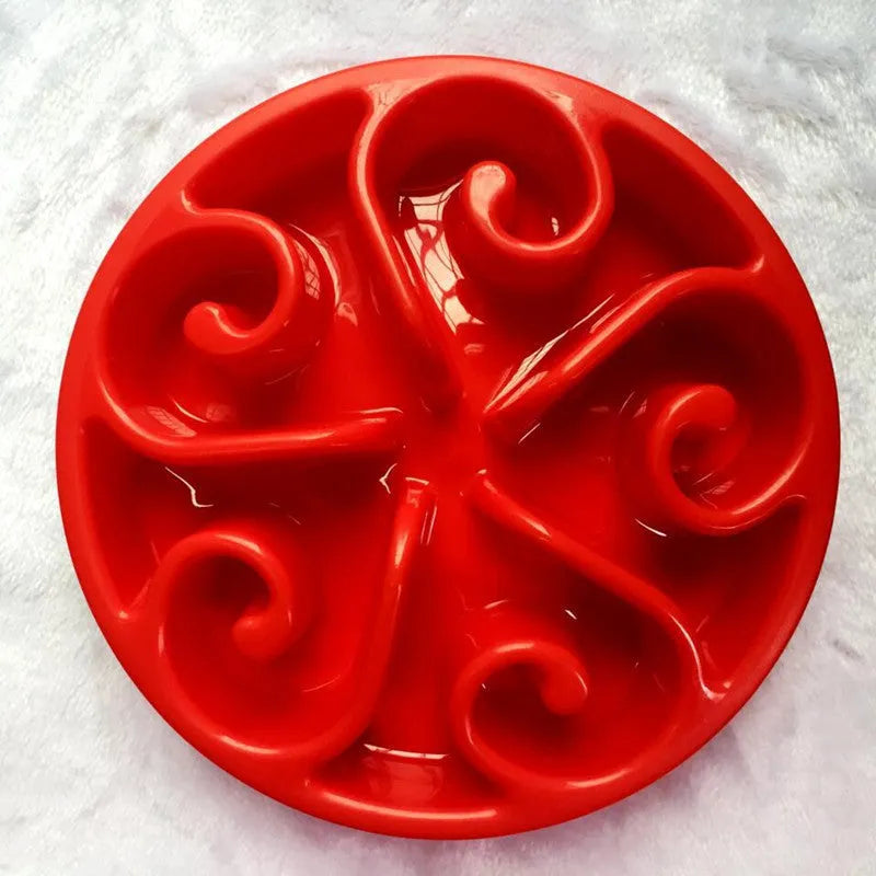 A slow feeder dog bowl with a maze pattern inside and a non-slip base, shown in blue.