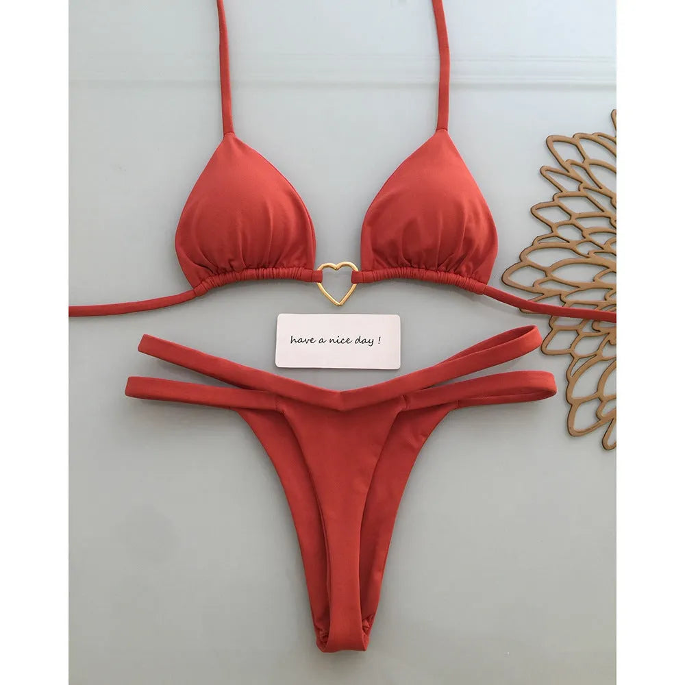 White floral bikini set on display, two-piece briefs style with nylon and spandex fabric