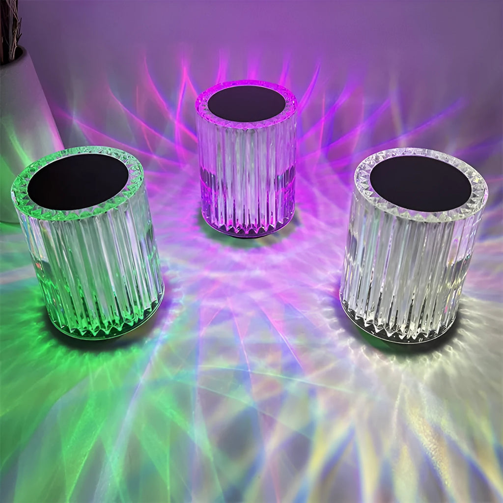 Compact acrylic crystal LED table lamp with RGB colours and remote control on a desk