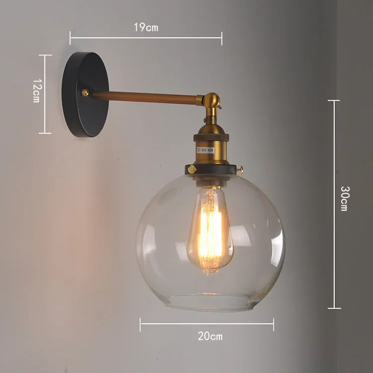 Round retro glass ball wall lamp in amber colour, 20cm diameter, with aluminium holder.
