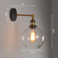 Round retro glass ball wall lamp in amber colour, 20cm diameter, with aluminium holder.