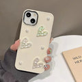 Milky white TPU phone case with pleated heart pattern and small pearl embellishments for iPhone