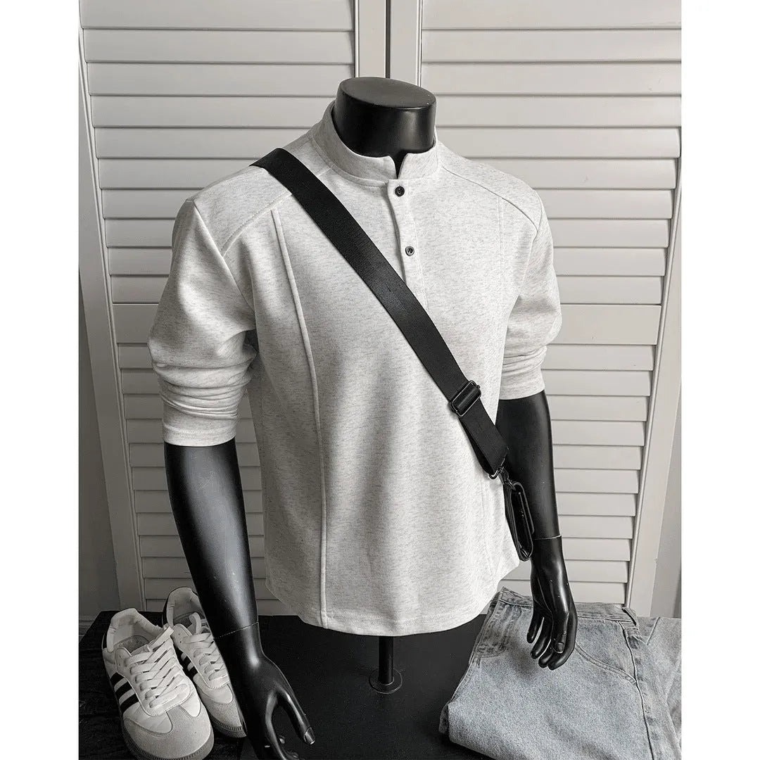 Men's grey asymmetric polo shirt with a patchwork stand-up collar and long sleeves.