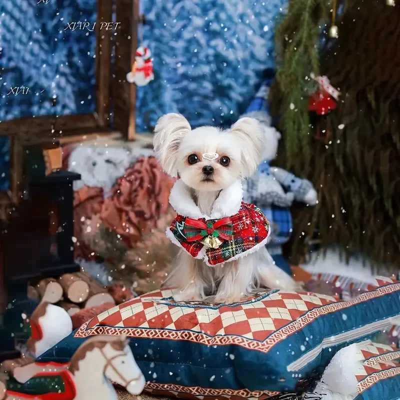 Red festive pet scarf with bell design on a dog, showing the polyester material and cloak-style fit.