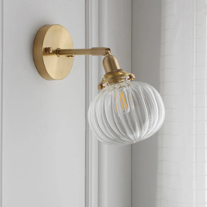 Pumpkin-shaped glass wall lamp in blue and transparent water ripple glass finishes.