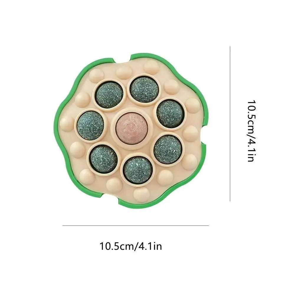 Green adhesive catnip ball toy for walls measuring 10.5x10.5cm with edible filling