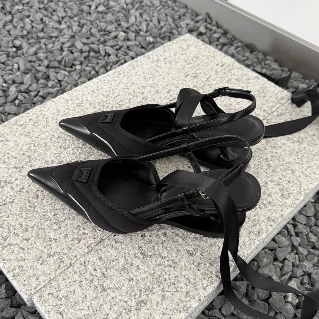 Women's special-shaped root lace-up high heels in black and pink, showing cowhide upper and lace detail.