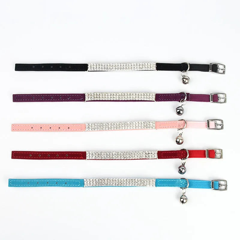 Adjustable velvet cat collar with a rhinestone in red, blue, purple, black, or pink.