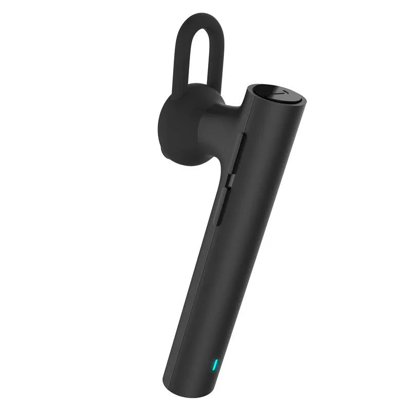 Compact black and white wireless Bluetooth headset showing size scale.