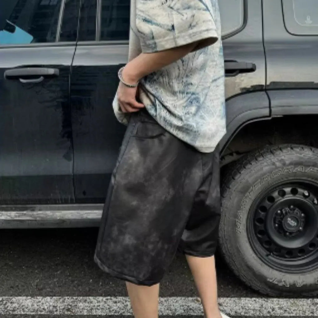 A man wearing a solid-colour, loose-fit, short-sleeve t-shirt in a Korean style.