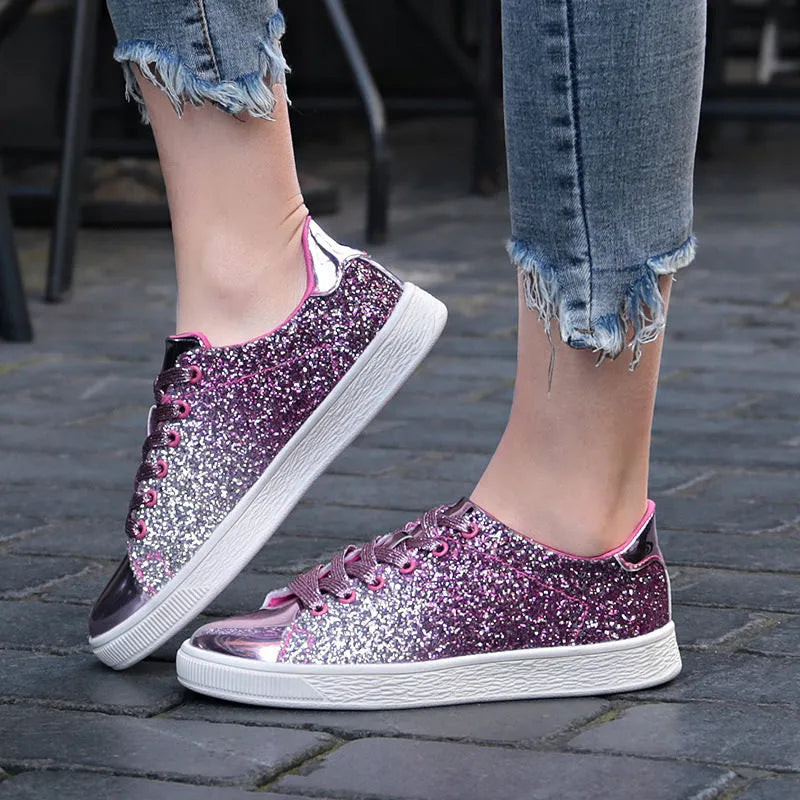 Women's black sequinned lace-up casual shoes with a round toe and rubber sole, shown from the side.