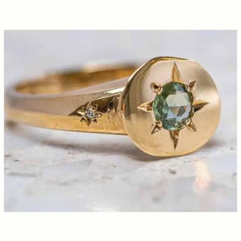 Gold-colour adjustable ring with a micro-inlaid oval star design on a zinc alloy band.