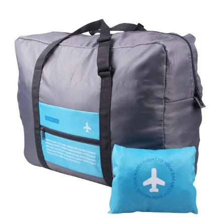 Large capacity foldable nylon travel bag in blue, showing open storage and compact folded size on suitcase