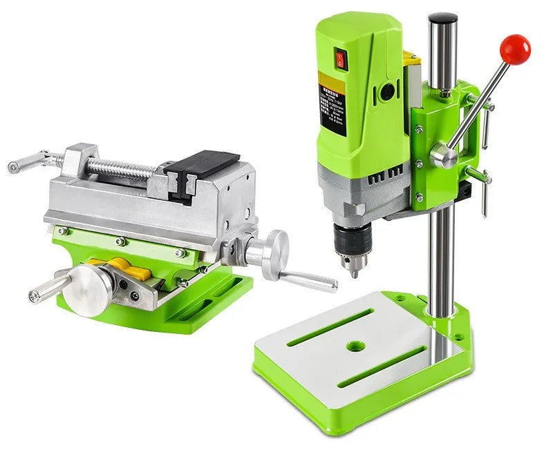 Mini bench drill and milling machine with 1050W drill and bench pliers on a workbench.