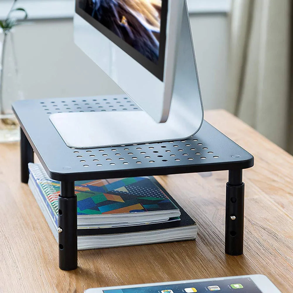 Black mesh iron display stand with three adjustable height settings for monitors and laptop cooling